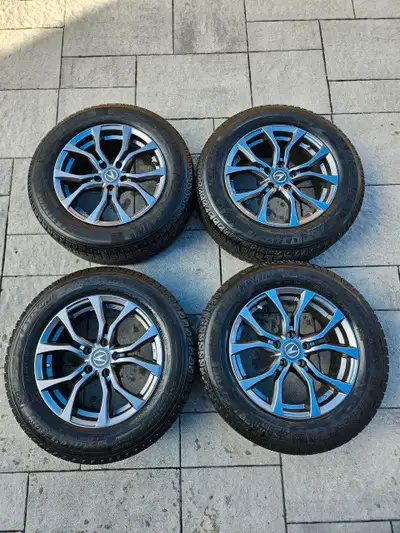 Selling a set of used Acura tires and rims, perfect for winter driving with a 225/65R17 tire size, o...