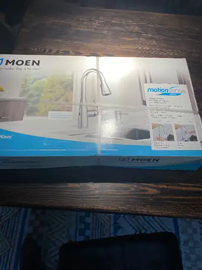 Brand new Moen sensor wave Kitchen faucet , faucet retail 480 dollar asking 250 dollar obo, text of...