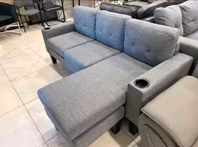 This is a stylish and comfortable used sectional sofa, perfect for a living room or entertainment ar...