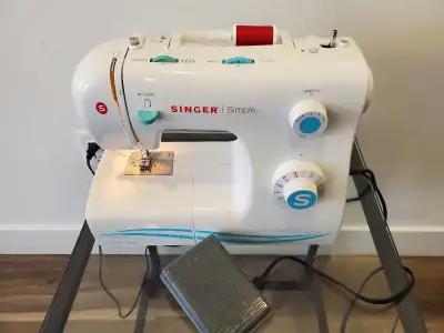 Singer Sewing Machine in excellent condition. Comes with extras. Located in Halifax, delivery is ava...
