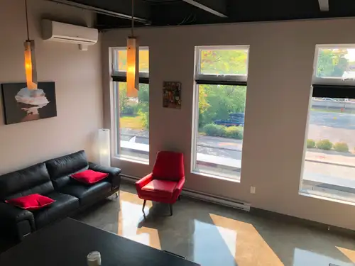 Beautiful modern studio in a new building ,5 appliances & internet included. Cement floor and 12 foo...