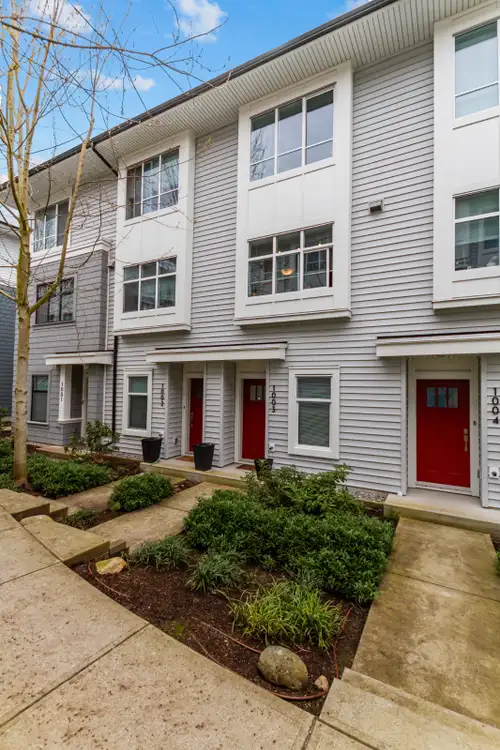 This rental unit offers a cozy living room, dining area and a modern kitchen with quartz countertop...