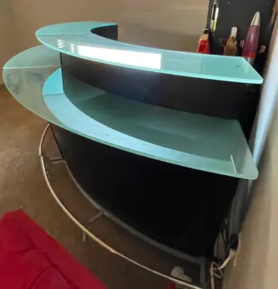 Two bar units that go together. Total length is about 106 in. Beautiful glass tops and counters. Ins...