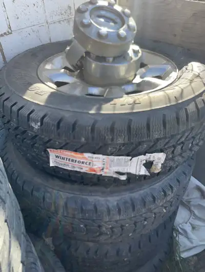 Complete set studed winter tires on Ford 350 rims ready to switch