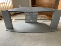 Used TV stand with built in glass shelf