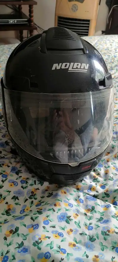 This is a used Nolan N80 motorcycle helmet, perfect for any rider looking for reliable head protecti...