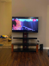 TV with stand and Roku player