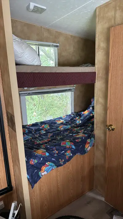 Sleeps 8, AC, lots of storage, room for TV, rear bunk beds, new flooring installed this year.