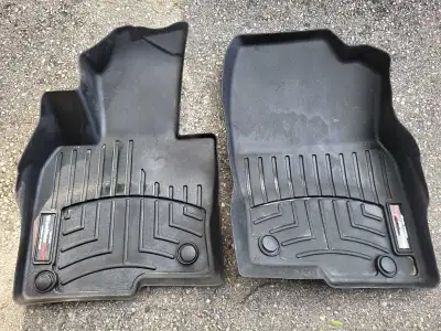 These pre-owned WeatherTech FloorLiner mats are precision-fit for a 2017-2025 Mazda CX-5, offering m...