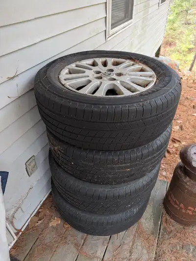 Selling a set of 4 Michelin Defender All-Season tires with Toyota rims. Good condition. P225/65 R17.