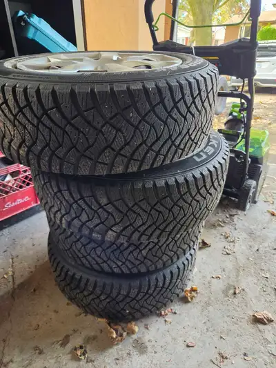 Selling a set of Falken Peak F-Ice winter tires and steel tims with 4 matching hub caps. 205/60R16 U...
