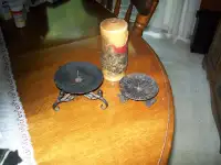 two metal candle holders and a hershey chocolate raised motif c