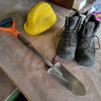 Tree planting boots, shovel, and hard hat.