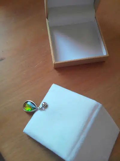 I have a beautiful Ammolite and White Sapphire teardrop pendant available. Measures 18x11 mm set in...