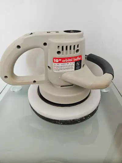 This is a used 10-inch electric orbital buffer, perfect for your polishing needs! It runs at 3300 RP...