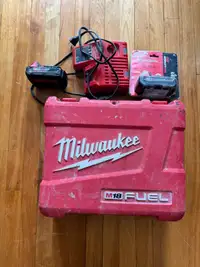 1 New Milwaukee Battery,1 used battery and charger/case