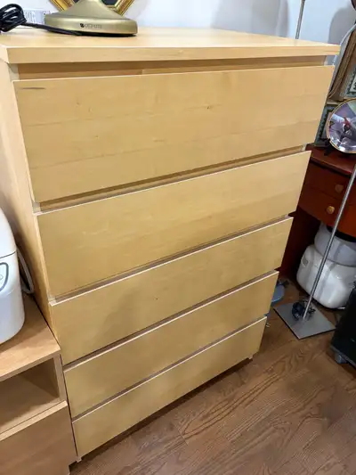 This is a used Ikea Hemnes dresser with five drawers, offering ample storage for your clothing and a...