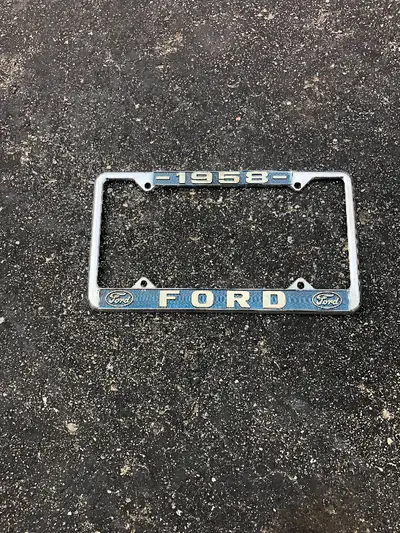1958 FORD LICENSE PLATE TRIM , METAL, BEEN HANGING ON WALL QUITE A FEW YEARS, GOOD CONDITION, READY...
