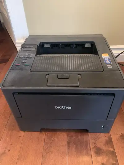 This is a Brother HL-5470DW laser printer, known for its reliable performance and duplex printing ca...