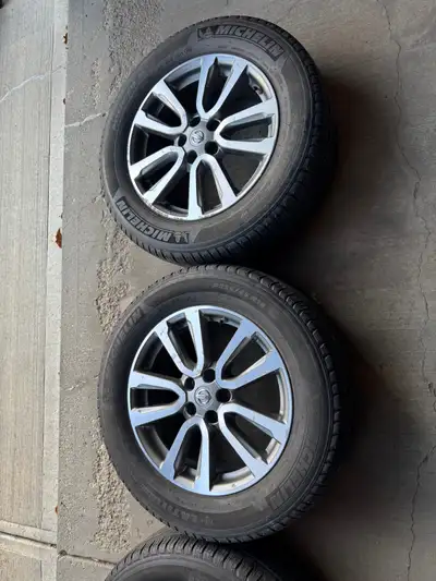 4x nissan rims comes off Pathfinder in great conditions. 4 tire pressure sensors installed. Tires ar...