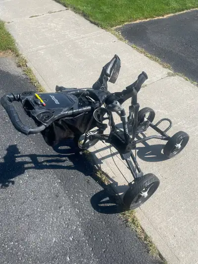 Used Bagboy Quad golf cart. In great shape. Hand brake, umbrella holder included,hinged cover storag...