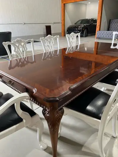 This elegant, Chippendale style table with ball & claw feet, pierced splat backs on chairs and cabri...