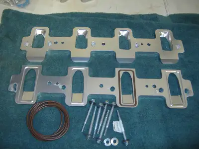 Billet aluminum adapters for rectangle port manifold to cathedral port heads. Google ICT Billet 5513...