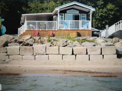 **FINANCABLE WATERFRONT AT WYLDEWOOD BEACH CLUB #80!!!** This beach house cottage has 3 bedrooms, 1...