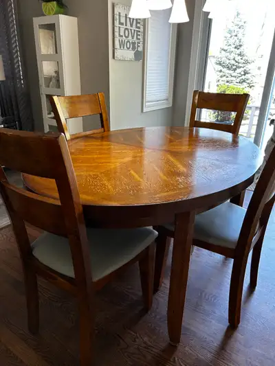 Wood table and 4 chairs. Originally purchased from Stoney Creek Furniture. Measurements: 60L x 42W....