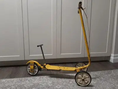 Kid's Honda Kick and Go from the 1970"s. This is a non motorized scooter - manual operation. Copied...