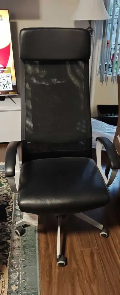 This is an IKEA Markus office chair, a great option for anyone looking for ergonomic support during...