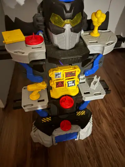 Opens up into interactive toy for little action figures and lights up. Comes with bat figure thing