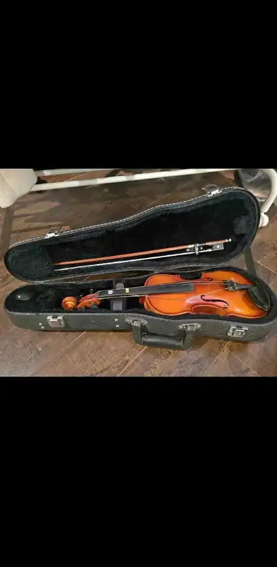 This is a used violin that is ready to play. It comes with a bow, case and shoulder rest. The instru...