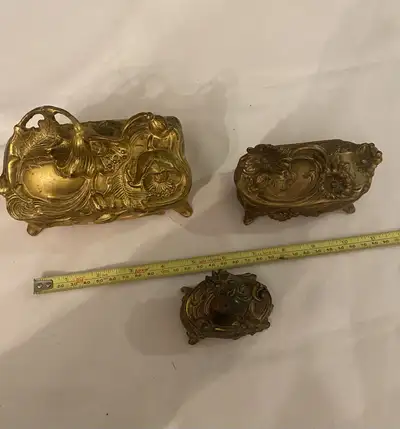 Adorn your space with this set of three antique Art Nouveau metal jewelry box caskets. These ornate...