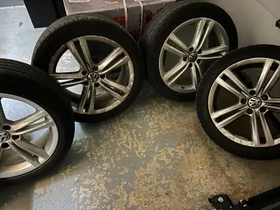 18 inch Volkswagen mags with Continental summer tires 235-45-18. Bolt pattern is 5x112. Tires are go...