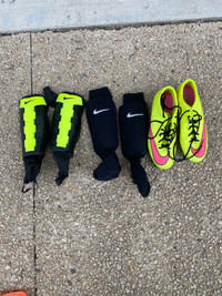 Nike Soccer Cleats and 2 sets of Shin Pads
