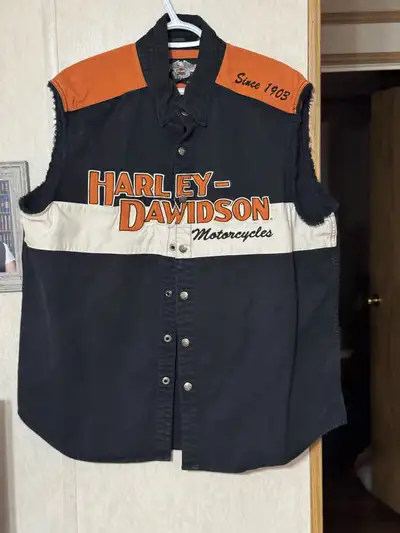 10 XL Harley Garage Shirts. Also Harley denim vest. Also included is an iconic Ymir Hotel Bar and Sh...