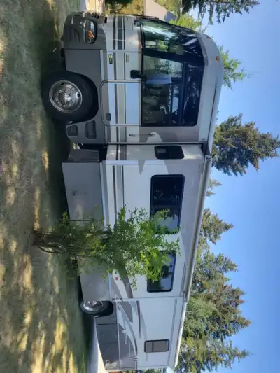 2003 Winnibego Motorhome Class A Excellent condition and runs like a top 2 slides, built in generato...
