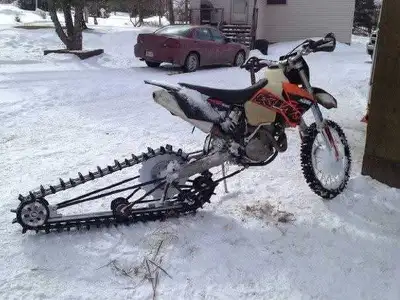 Home made track kit. Installs in minutes in place of a KTM back wheel. Spare rails and idlers thrown...