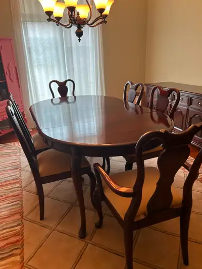 Dining table with 6 chairs ( 2 are arm chairs ); 3 leaves, 2 different size table pads; sideboard; s...