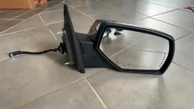 Passenger side mirror for GMC Sierra 1500 Denali for sale. It has a chrome back and is fully functio...