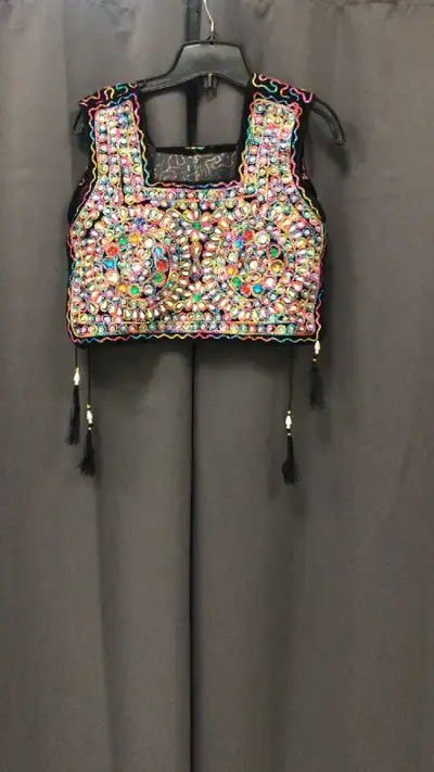 Add some sparkle to your wardrobe with this unique vintage sequined vest! This eye-catching piece fe...