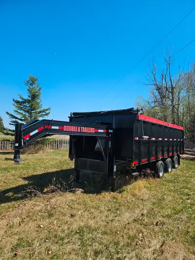 This Double A fifth wheel trailer is 22 feet in length and is equipped with three 10000 pound dexter...