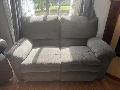 Grey couch and loveseat with recliners on each end overall good condition, pet friendly house the ba...