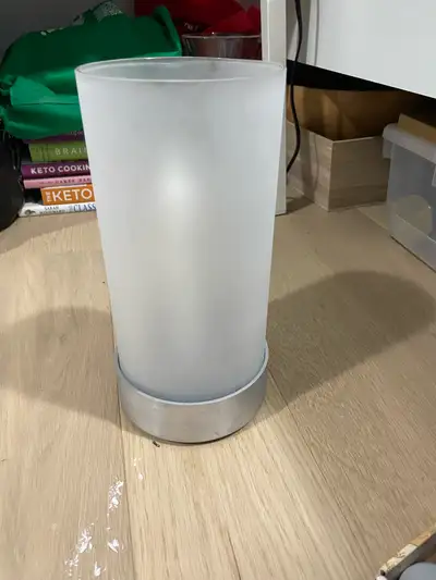 Illuminate your space with this gently frosted IKEA candle holder, designed to create a soft and inv...