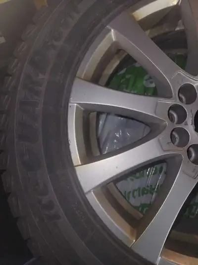 Offering a set of used Yokohama IceGuard IG51 snow tires mounted on rims(included) Tires size 215/65...
