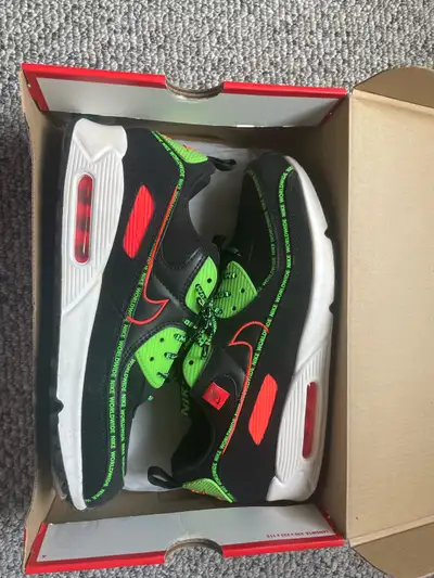 Step into style with these Nike Air Max 90 WW shoes, size 11, featuring a striking black, flash crim...