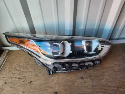 This is a used 2023 KIA FORTE RIGHT HEADLAMP in good condition. There are some visible scratches and...