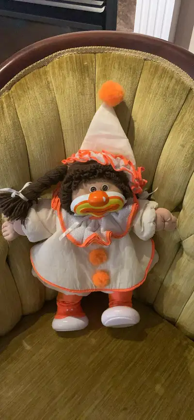I'm selling a vintage 1982 Cabbage Patch Kid clown doll, a unique and collectible piece that brings...