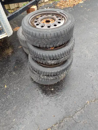 Set of 4 Nokian snow tires on a 4 bolt rim 180 55R 16 enough tread for at least one season